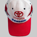 Casquette Toyota F1 Panasonic Racing vintage blanche et rouge d’occasion, vue de face avec logos Toyota et Panasonic brodés.