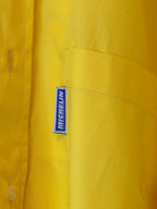 Détail marquage MICHELIN sur chemise jaune vintage taille L