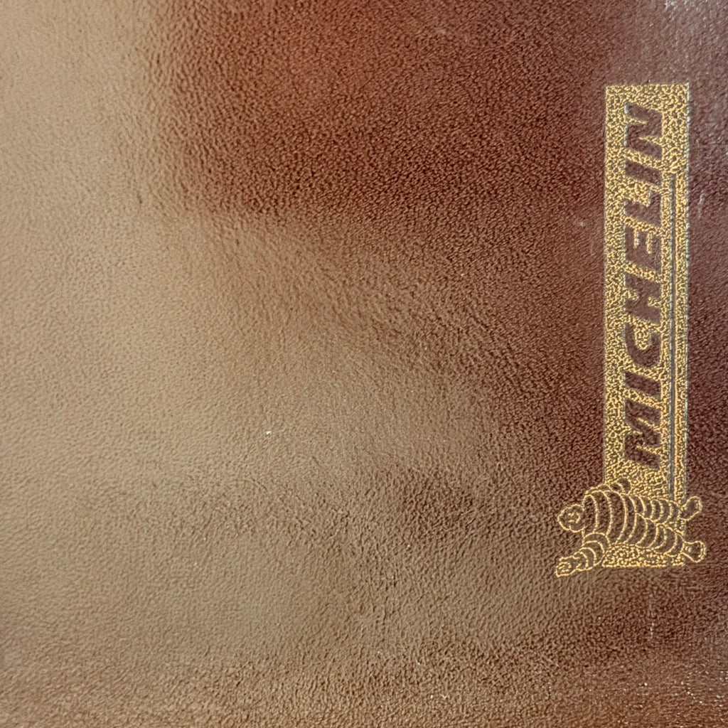 Marquage Michelin sur porte-documents vintage en cuir marron