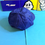 Vue arrière de la casquette Michelin Cholet bleue avec fermeture plastique réglable.