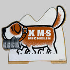 Autocollant vintage Michelin X M+S représentant un chien portant des pneus, référence 2968.