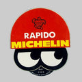 Autocollant vintage Rapido Michelin avec Bibendum, fond rouge et jaune, référence 3383, format 5 × 5 cm.