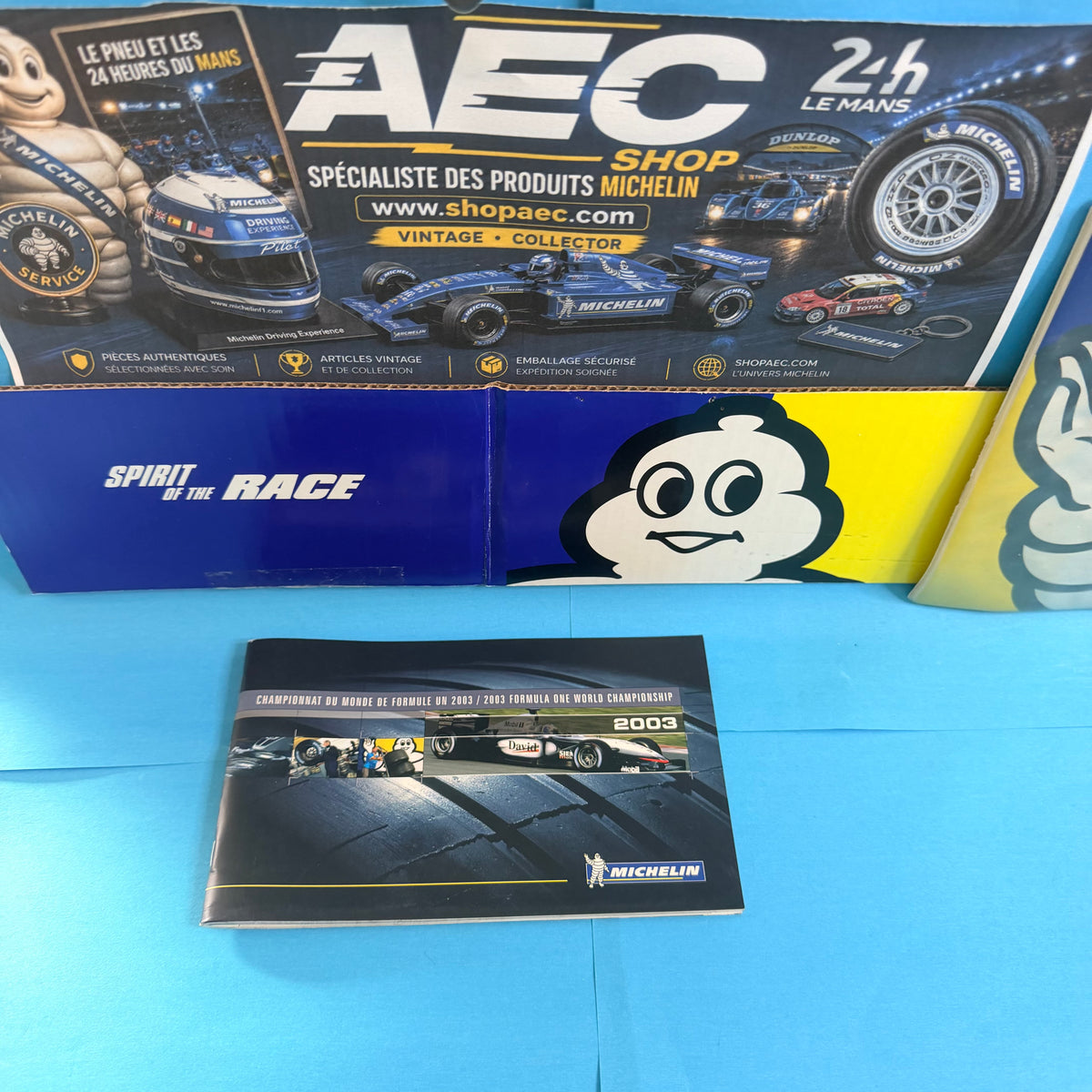 Brochure collector Michelin Formule 1 2003 présentée dans l'univers Shop AEC, document historique destiné aux collectionneurs de sport automobile.