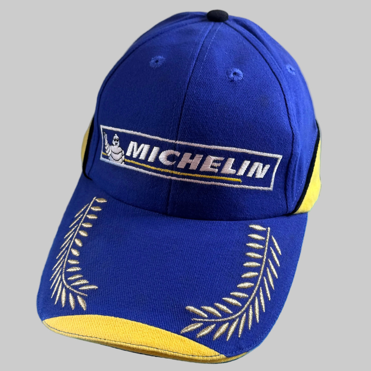 Casquette Michelin Podium neuve bleue et jaune avec logo Bibendum et lauriers brodés sur la visière