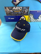 Casquette Michelin Formula 1 neuve présentée de face, coloris bleu marine avec bordure jaune et broderies F1