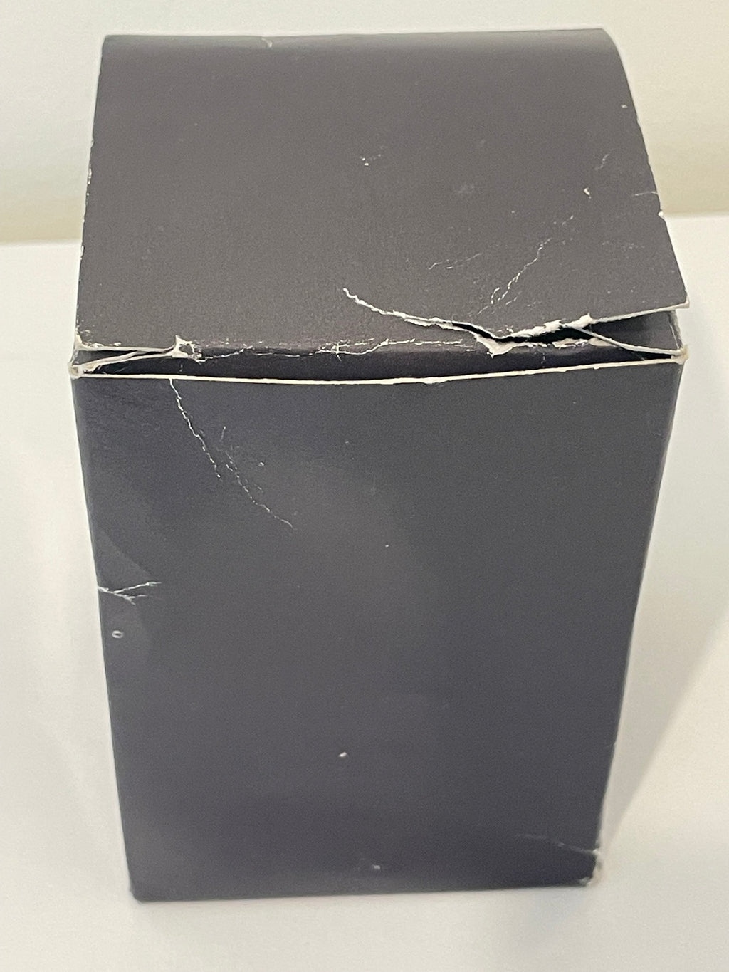 Boîte d’origine du coquetier MICHELIN Bibendum collector présentant des traces d’usure