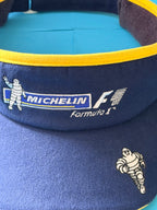 Détail des broderies Michelin Formula 1 et Bibendum sur la visière F1 Spirit of the Race.