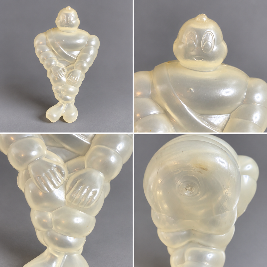 Observation rapprochée des mains, du visage, de la matière et des traces de moulage. Une finition particulièrement inhabituelle pour une représentation de Bibendum.