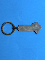 Dos du porte-clés Michelin Bibendum vintage en métal avec marquage du fabricant FRAISSE PARIS.
