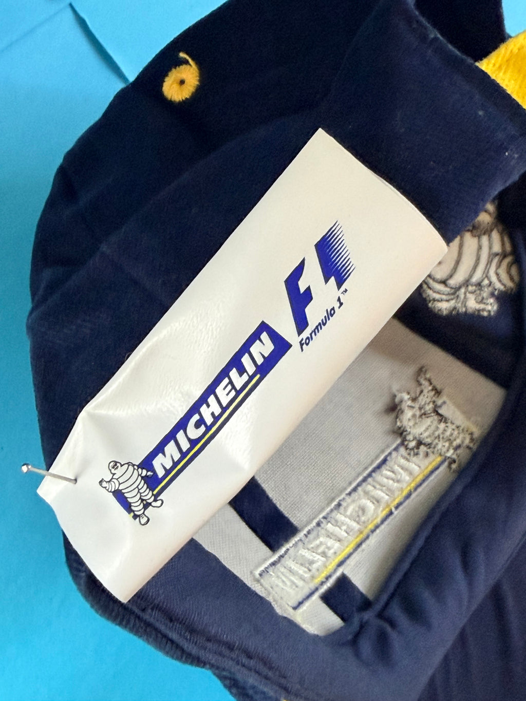 Étiquette Michelin Formula 1 de la casquette F1 neuve avec logos Michelin et Bibendum