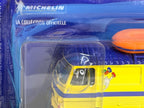 Vue rapprochée du Peugeot J7 Jeu de plage Michelin, reproduction miniature d'un utilitaire français aux couleurs du manufacturier.