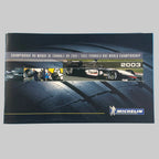 Programme Michelin Championnat du monde de Formule 1 2003, publication originale d'époque avec monoplace de compétition et logo Michelin.
