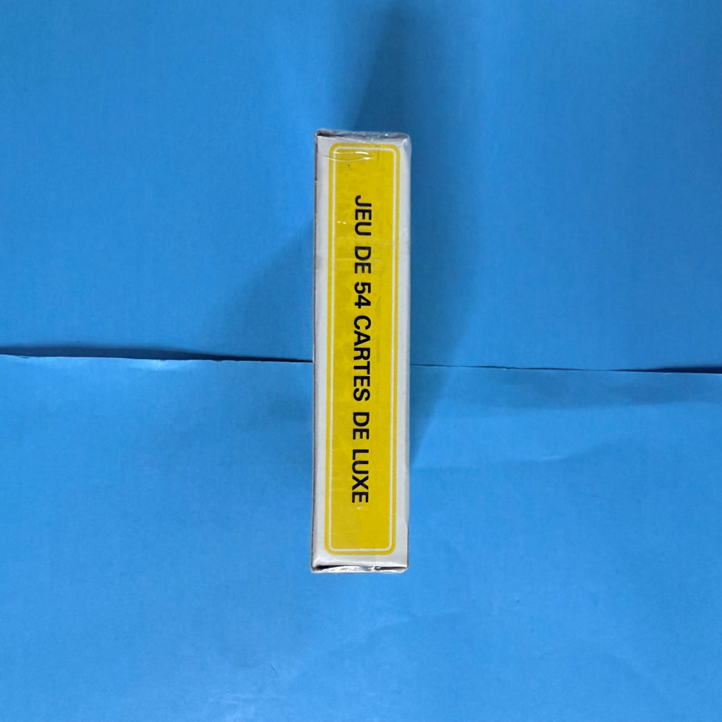 Tranche du coffret Michelin neuf sous emballage scellé, portant l'inscription Jeu de 54 cartes de luxe sur fond jaune.