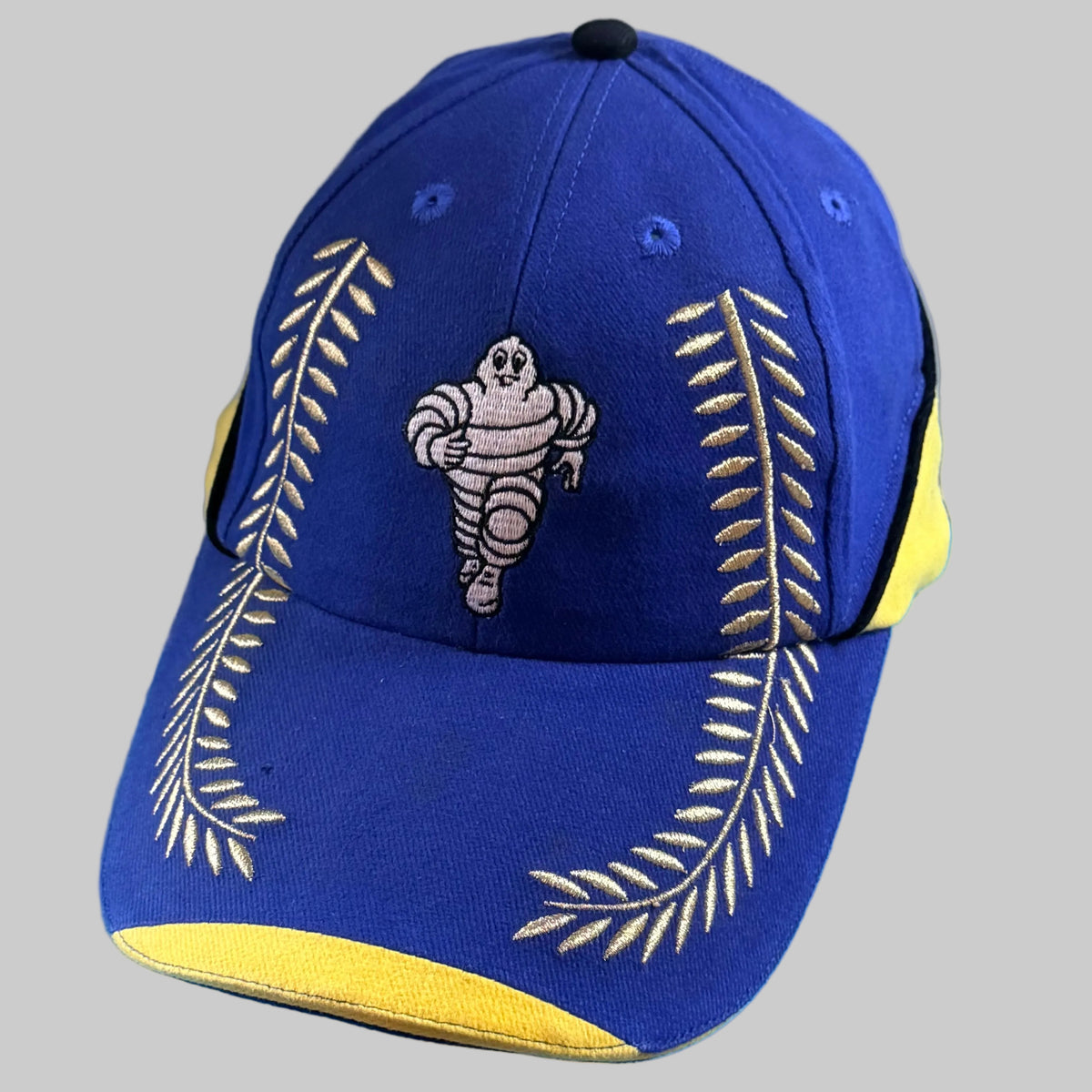 Casquette Michelin Podium neuve bleu et jaune avec Bibendum et lauriers brodés sur la visière