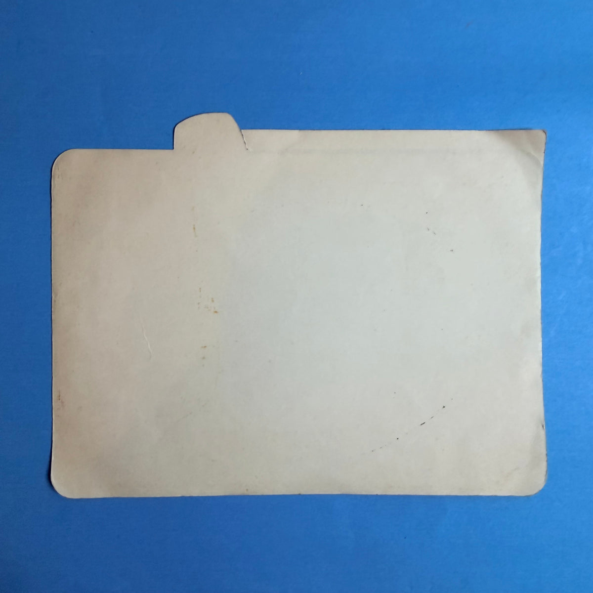 Verso de l’autocollant publicitaire Michelin ZX vintage, montrant son support ancien et ses traces de conservation.