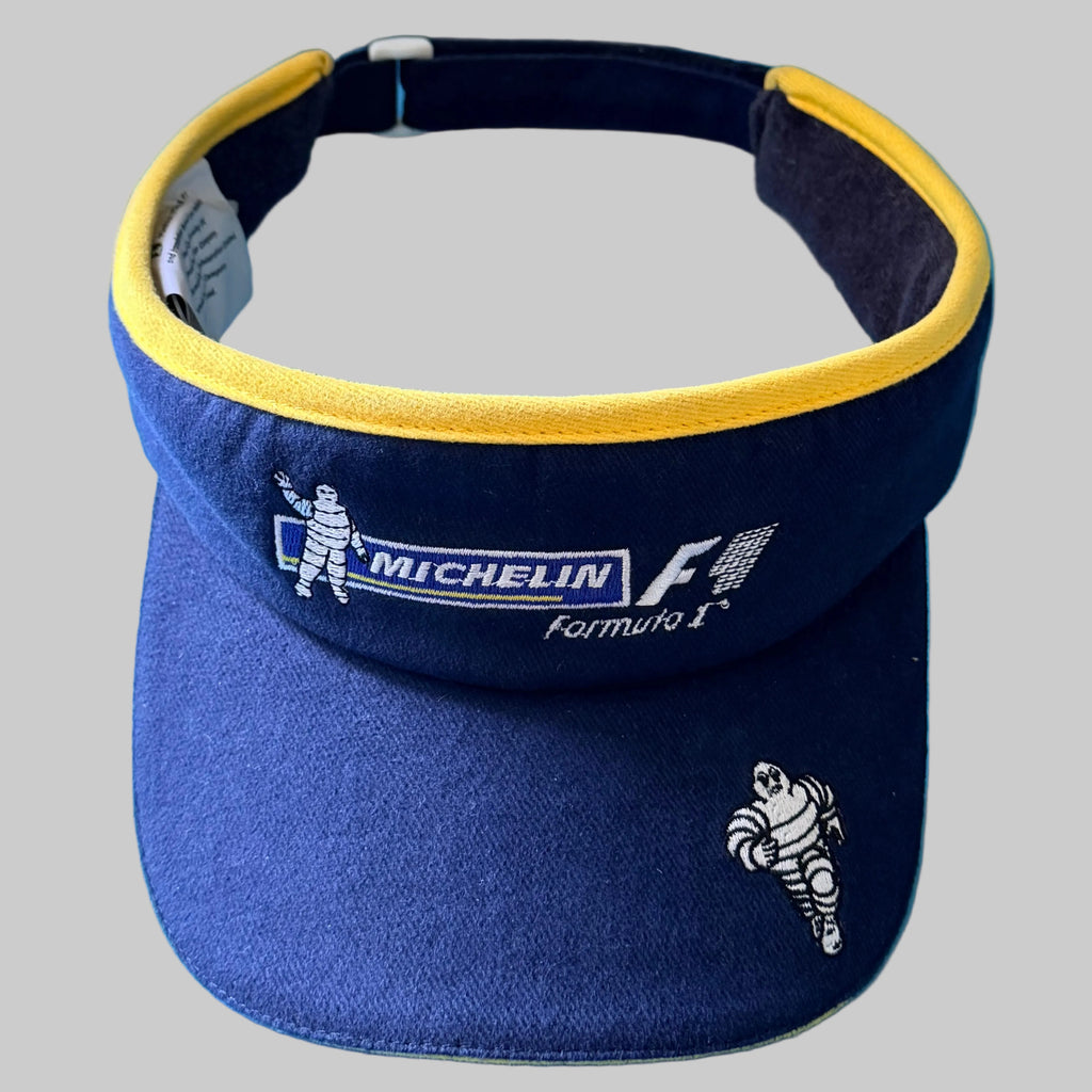 Photo 1 : Visière Michelin Formula 1 Spirit of the Race bleu marine et jaune avec logos F1 et Bibendum brodés.
